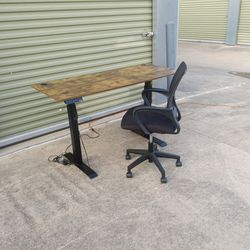 Office Chair and Electric Office Desk in great condition No damage to exterior 