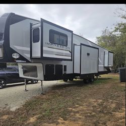 The 2025 Forest River Impression 32OFL is a mid-profile fifth wheel RV 