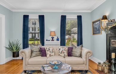 Beige Chesterfield-Style Sofa with Nailhead Trim