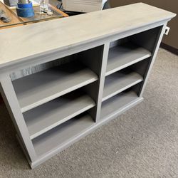 Solid pine painted gray bookcase. Very sturdy.