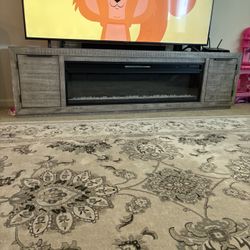 Gray 92” TV stand with fire place