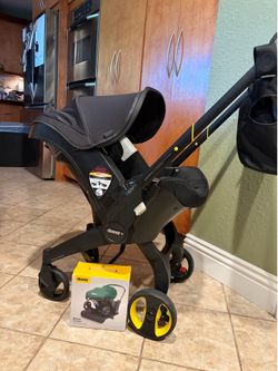 Doona Car Seat & Stroller: Midnight Edition + Accessories