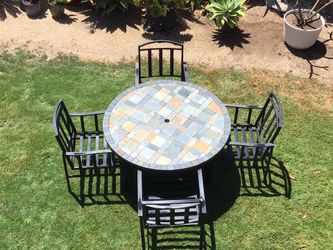 Wrought iron patio table with four chairs