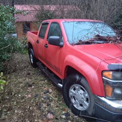 a red chevy colardo truck