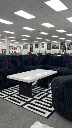 Elevate your living space with this Luxurious black sectional