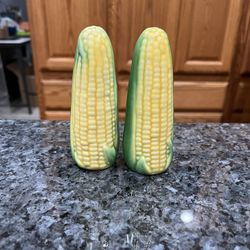 Vintage ceramic Corn Ear in Husk Salt and Pepper Shakers.  Size approximately 4 inches tall.  Preowned only on display.  Has been on display in a cabi