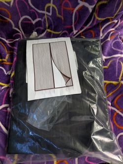 Magnetic closing screen door