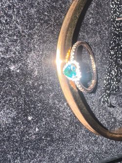 Gold plated pandora promise ring with green gem
