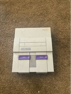 Super Nintendo with cables and controllers
