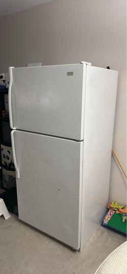 Free refrigerator. It runs but doesn't freeze.