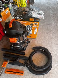 New RIDGID WD1060 wet/dry vacuum. It is 10 gallons (37 liters) with 6.0 peak HP. It has a stainless steel drum. It comes with a hose, extension wands,