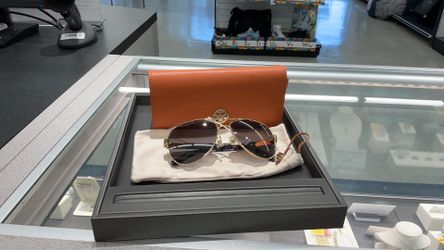 Pair of women's gold-tone metal aviator/pilot sunglasses by Tory Burch
