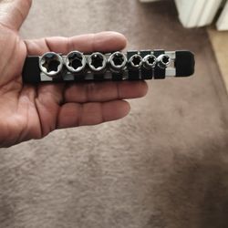 set of external Torx sockets, also known as E-Torx sockets, on a rail. 