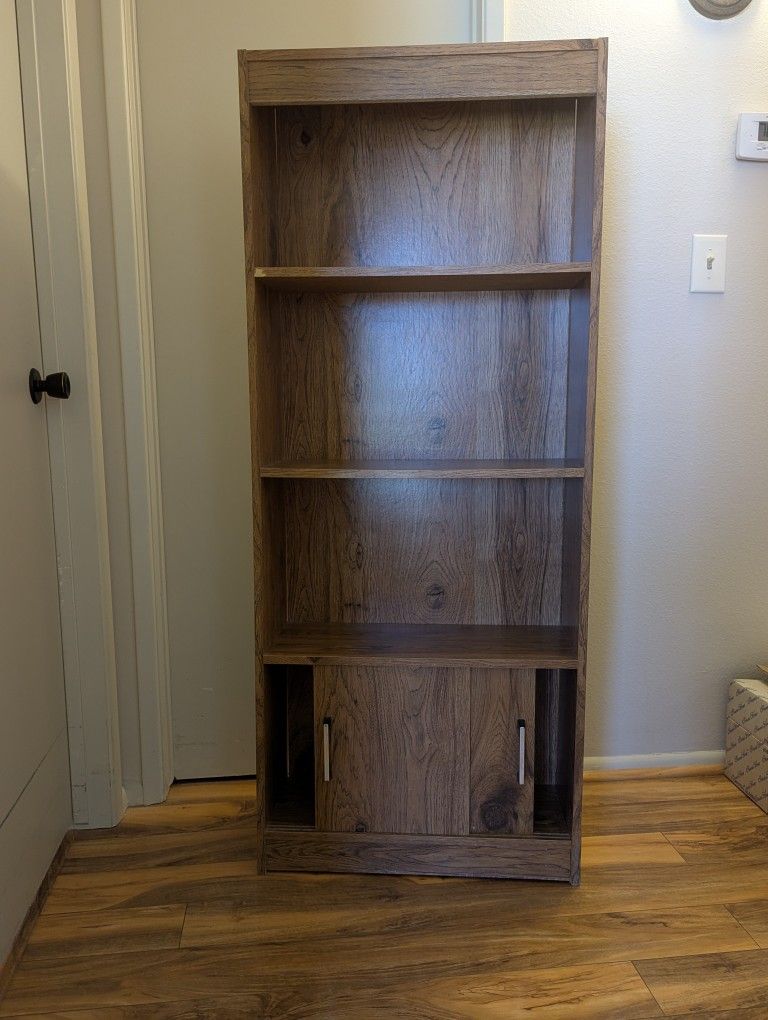 2 Bookshelves with sliding doors on bottom shelf
