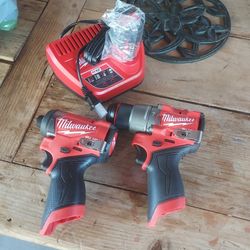  Milwaukee .M12 FUEL 12-Volt
Lithium-lon
Brushless
Cordless Hammer
Drill and Impact
Driver Combo Kit
w/1  Battery  2.0  And Charger Included 
