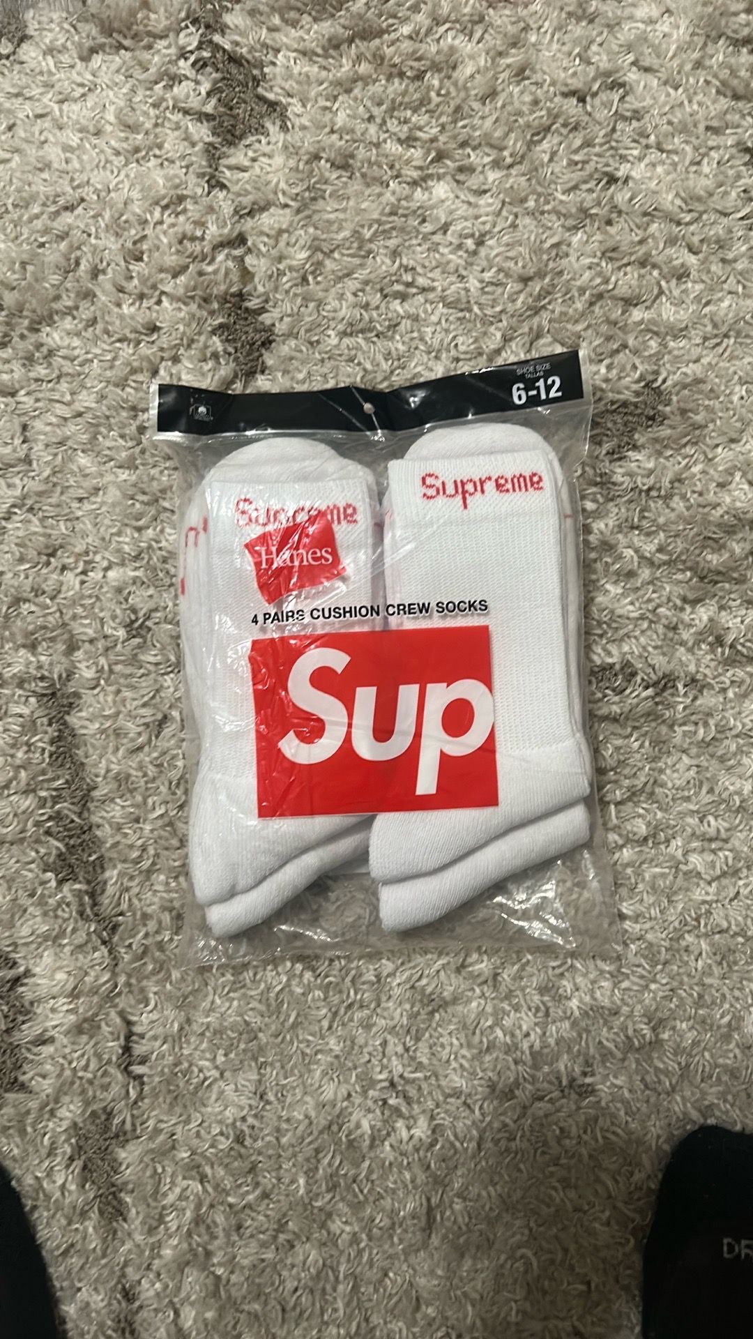 All white Supreme socks