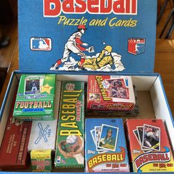 Lot of nine Mostly unopened boxes of baseball And football Cards