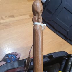 African hand Carved walking stick with pheasant feather and real fur.
ceremonial walking stick