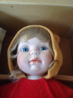 Poo Bear and porcelain doll new in box