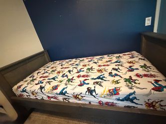 Twin bed . Wooden frame with mattress included
