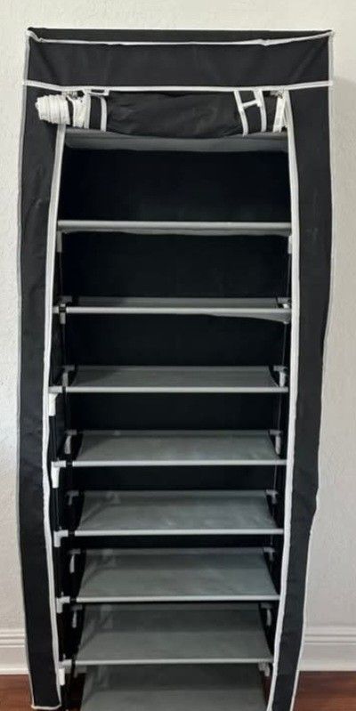 Like New 9 Shelf Shoe Rack Holds Upto 40 Shoes Or More.