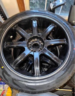 4 black multi-spoke rims + brand new tires