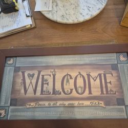 Wood framed welcome sign