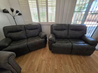 Grey leather love seats plus  matching recliner