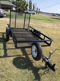 4’ x 6’ trailer with title, ramp, spare and swing up jack