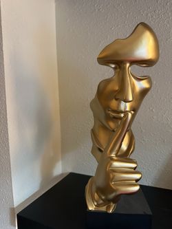 Golden face decor