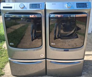 Maytag front loading washer and dryer on pedestals