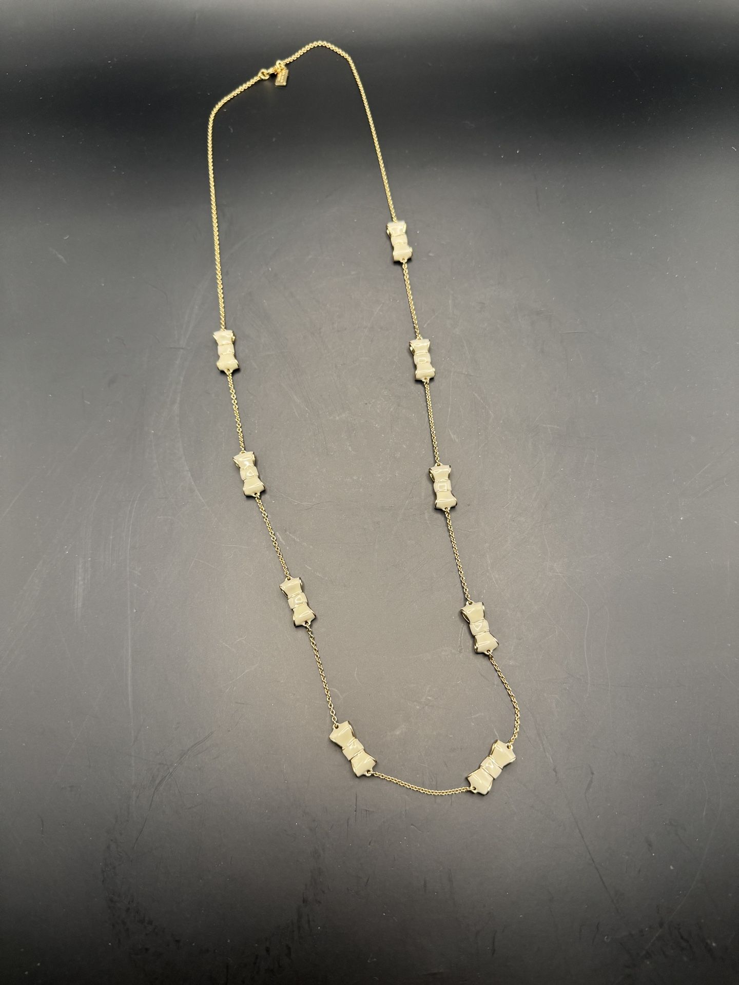 Kate Spade Take a Bow Gold Necklace with Cream Bows - EUC