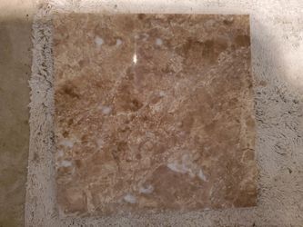 Thirty 12x12 porcelain tiles