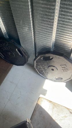 Two  50 pound cap barbell with holder so you can use with the bar