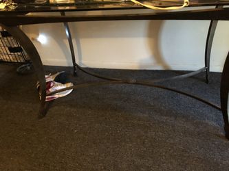 Glass table don’t mind the stuff on it great shape all glass cast iron holding stand 50 obo need gone ASAP sorry no chairs