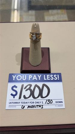 Gold Ring with Center Stone and Side Accents