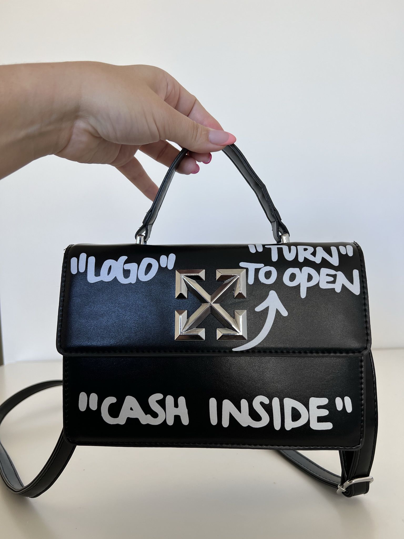 off white bag cash inside