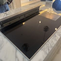 Miele 36” KM series induction cooktop w/ an integrated downdraft ventilation system - Retail: $6600