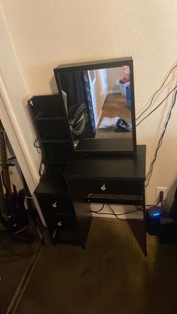 Black vanity with sliding mirror cabinet