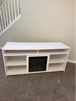 Long white TV stand with fireplace