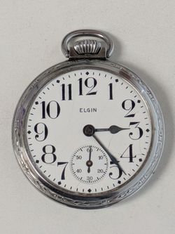 1934 Elgin National Watch Co. Pocket Watch. Has been running the whole time I have been posting this ad. Missing crystal glass cover. Beautiful 90 yea