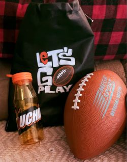 Kids / Youth Football Sports Gift Set! It includes a foam/rubber official-style football, a matching football-themed water bottle, and a black drawstr