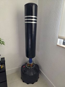 Almost new free standing Dripex  punching bag