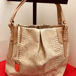 Vince Camuto handbag in a cream/beige Faux snakeskin pattern with tan trim.