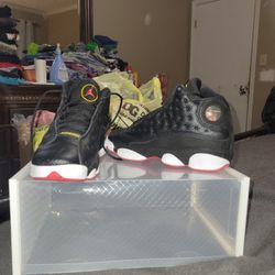 Nike Air Jordan 13 Retro "Playoffs" black, white, and red sneaker. 