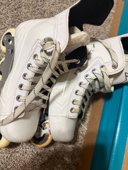 Hockey skates one without wheels and laces and one with both