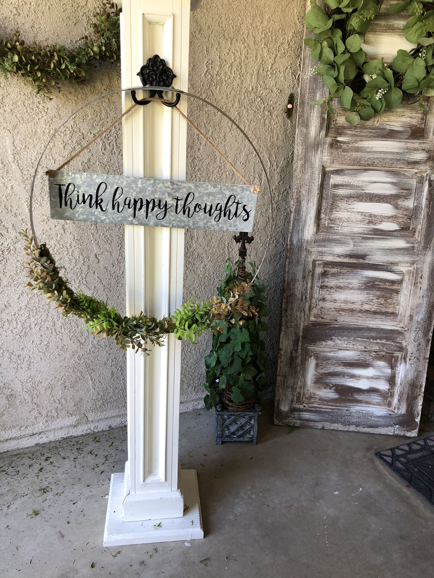Solid wood post with barrel ring wreath. Interchangeable sign.