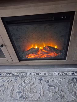 Entertainment center with fire place and heater