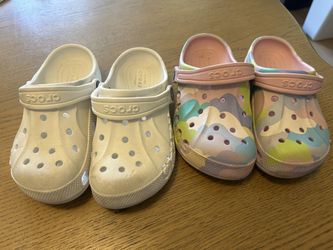 Two Pairs of Kids Crocs Classic Clogs