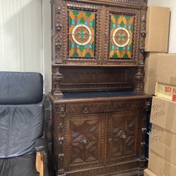 Antique liquor cabinet with stained window